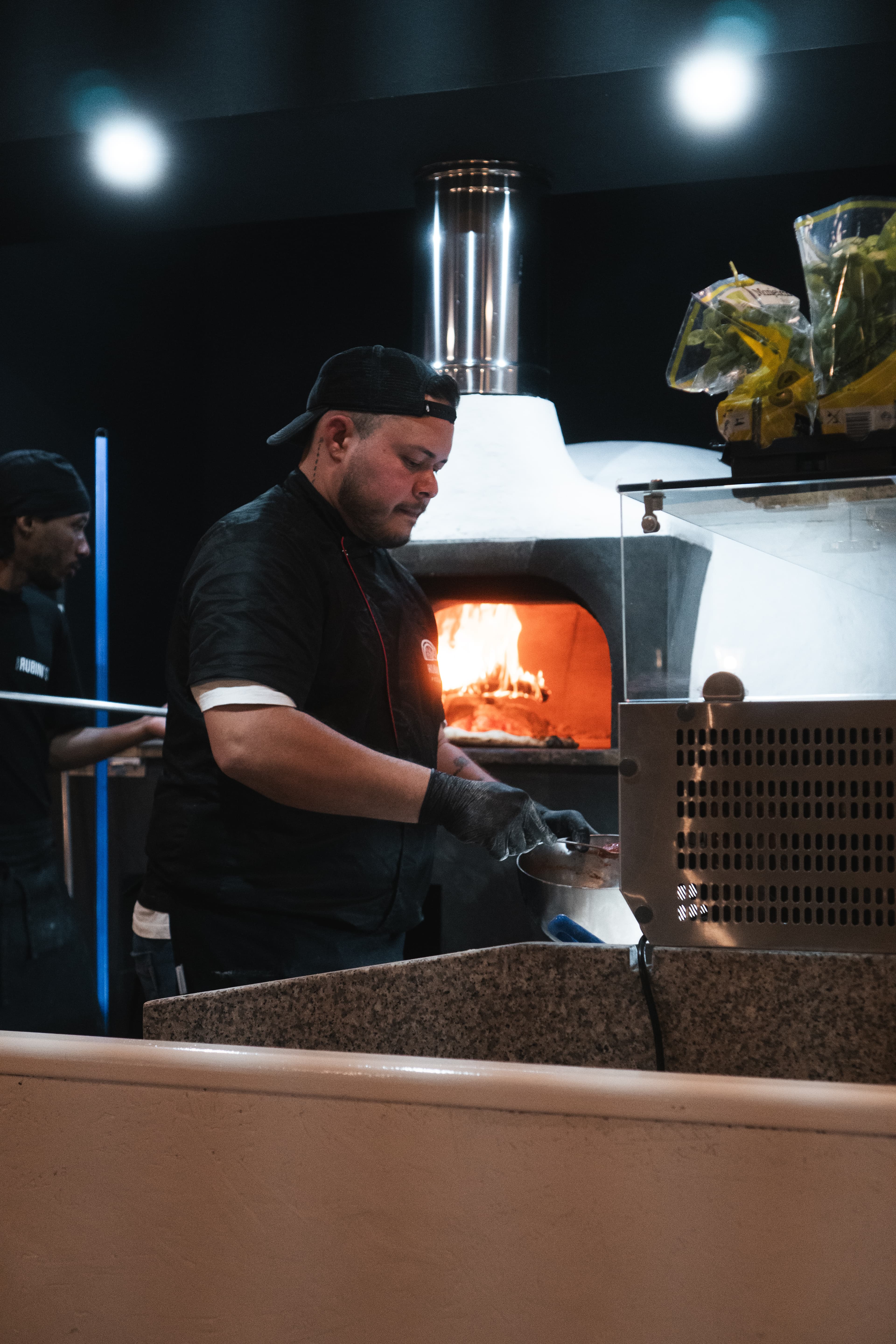Our pizzaiolo crafting authentic Neapolitan pizza